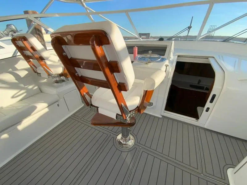 Slide: The Image of 2005 Viking 45 Open Express helm seating and cockpit area. - 27