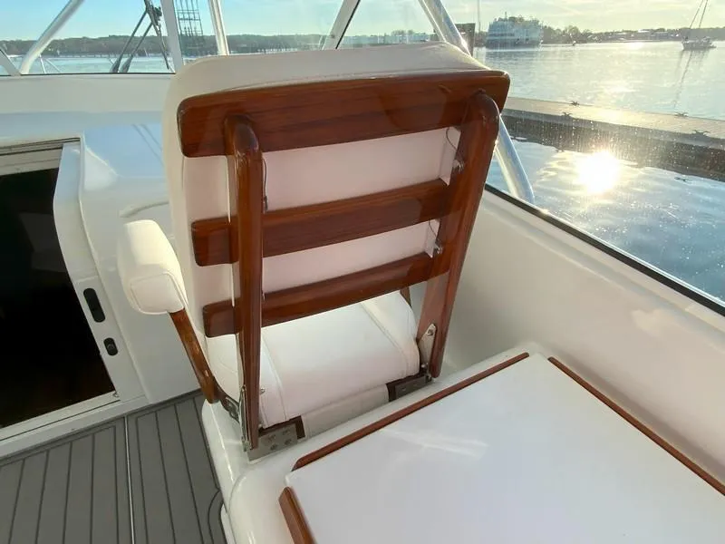 Slide: The Image of Captain's chair on a 2005 Viking 45 Open Express yacht, overlooking the water. - 29