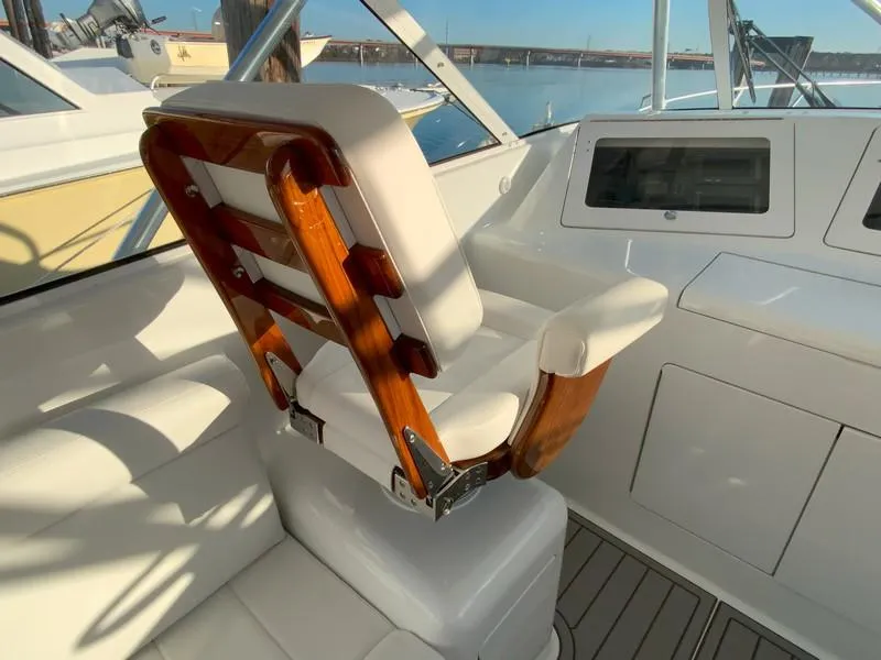 Slide: The Image of Captain's chair on a 2005 Viking 45 Open Express yacht. - 30