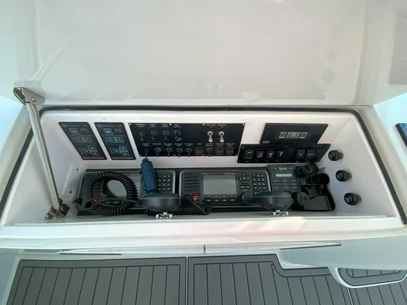 Slide: The Image of Control panel of a 2005 Viking 45 Open Express boat with communication equipment. - 37