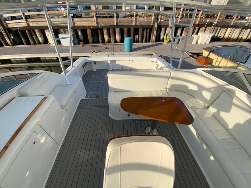 Slide: The Image of 2005 Viking 45 Open Express yacht with spacious deck and seating area. - 42