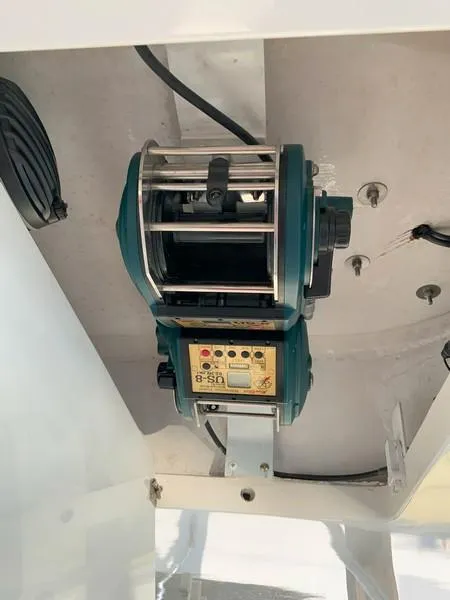 Slide: The Image of Electric fishing reel on a 2005 Viking 45 Open Express boat. - 43