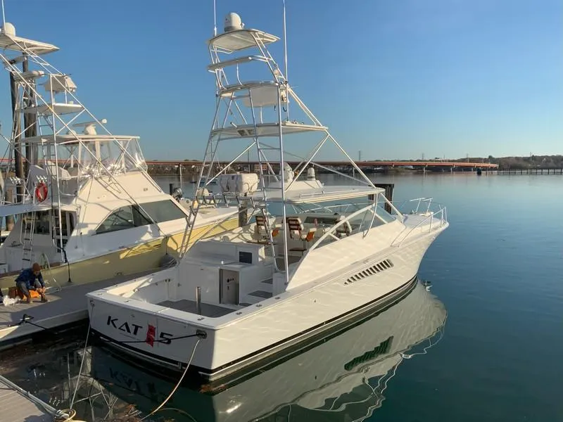 Slide: The Image of 2005 Viking 45 Open Express yacht docked at marina. - 5