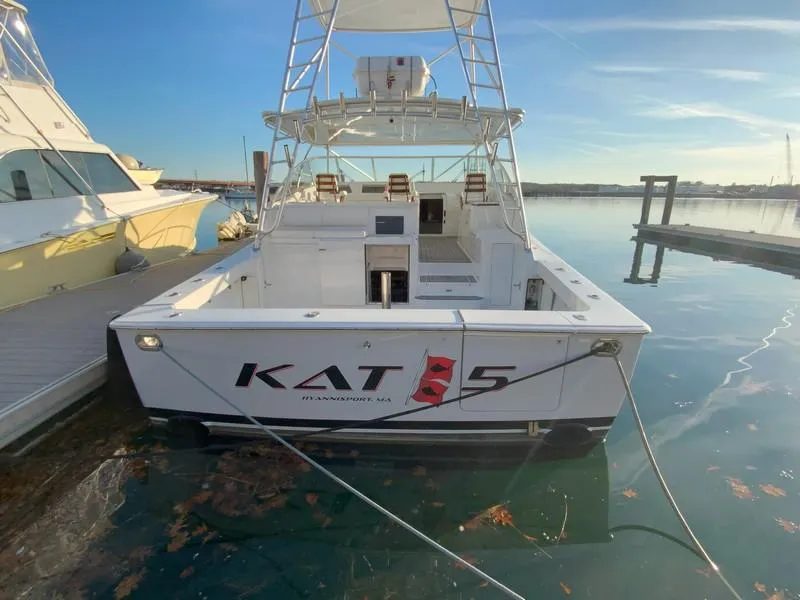 Slide: The Image of 2005 Viking 45 Open Express boat docked at marina, rear view. - 6