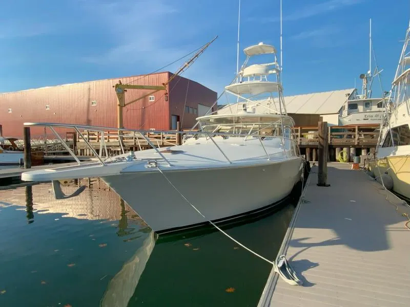 Slide: The Image of 2005 Viking 45 Open Express yacht docked at marina. - 8
