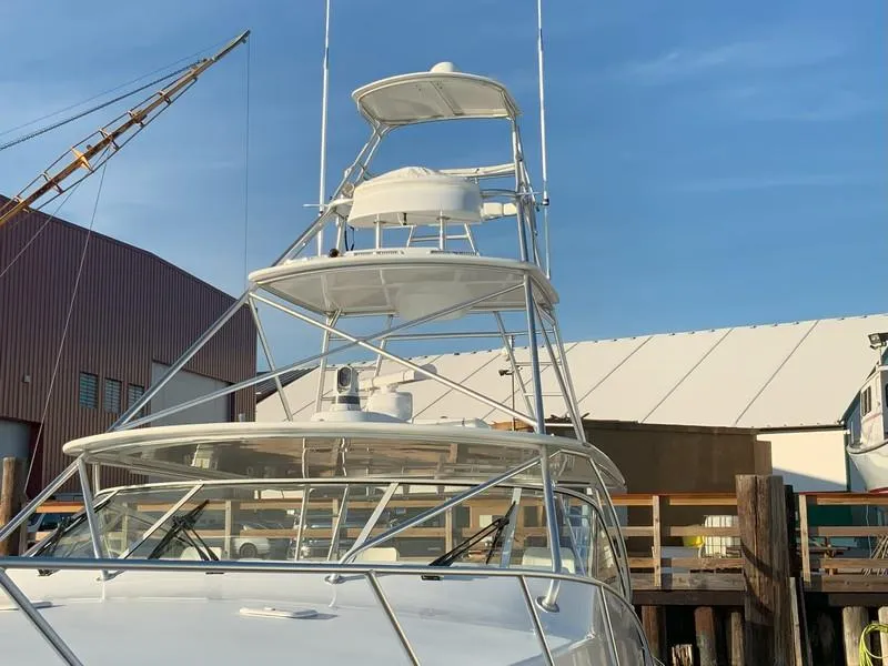 Slide: The Image of 2005 Viking 45 Open Express yacht docked at marina. - 9