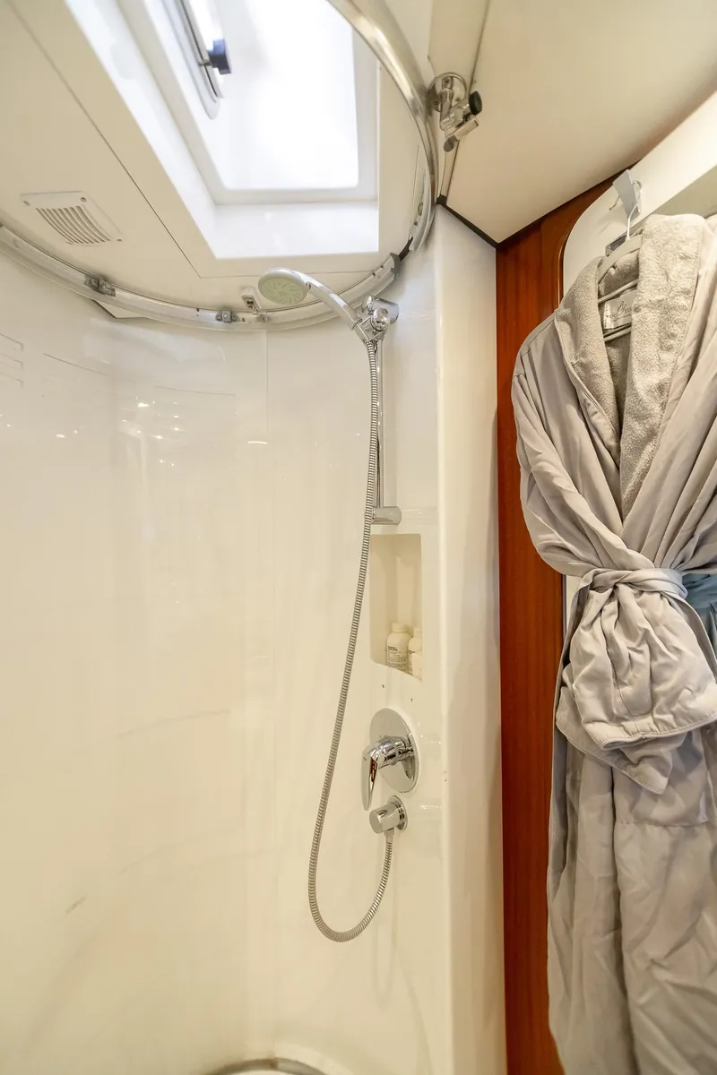 Slide: The Image of Luxurious shower area in 2011 Alia Yachts Warwick 82 LK with robe hanging. - 36