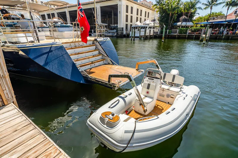 Slide: The Image of Alia Yachts Warwick 82 LK 2011 docked with tender boat in water. - 15