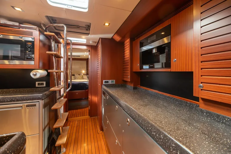 Slide: The Image of Luxurious kitchen interior of 2011 Alia Yachts Warwick 82 LK with modern appliances and wooden finishes. - 30
