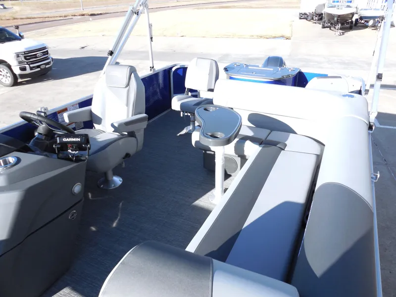 Slide: The Image of 2024 Bennington 20 SVF pontoon boat interior with seating and steering console. - 5