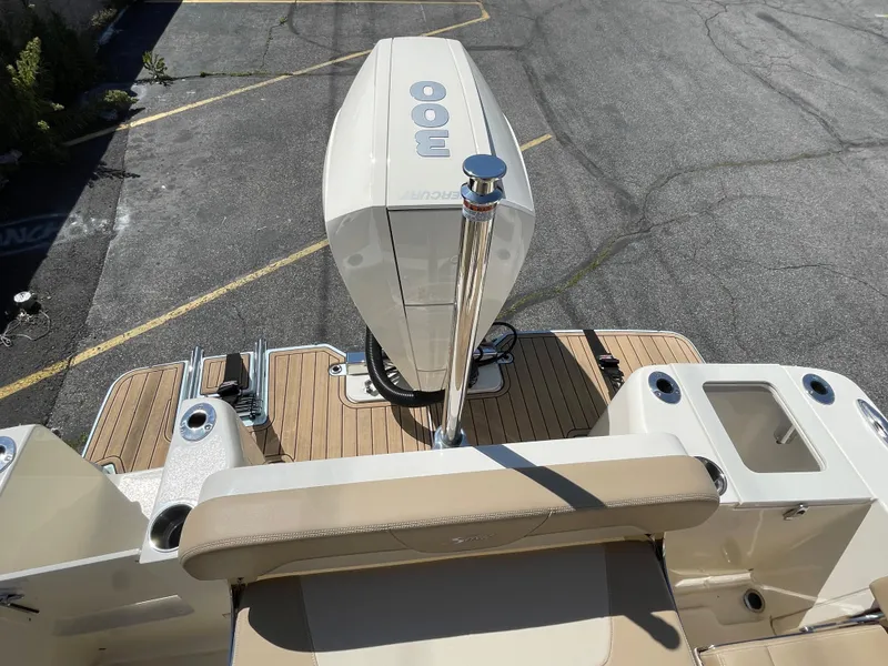 Slide: The Image of 2024 Scout 240 Dorado boat with outboard motor and teak deck. - 20