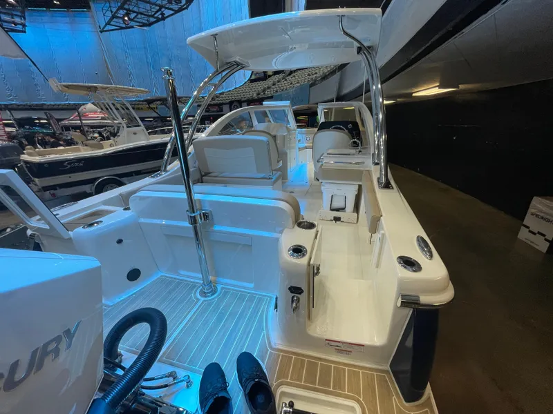Slide: The Image of 2024 Scout 240 Dorado boat interior with seating and helm station. - 3