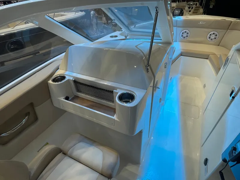 Slide: The Image of 2024 Scout 240 Dorado boat interior with seating and blue LED lighting. - 8