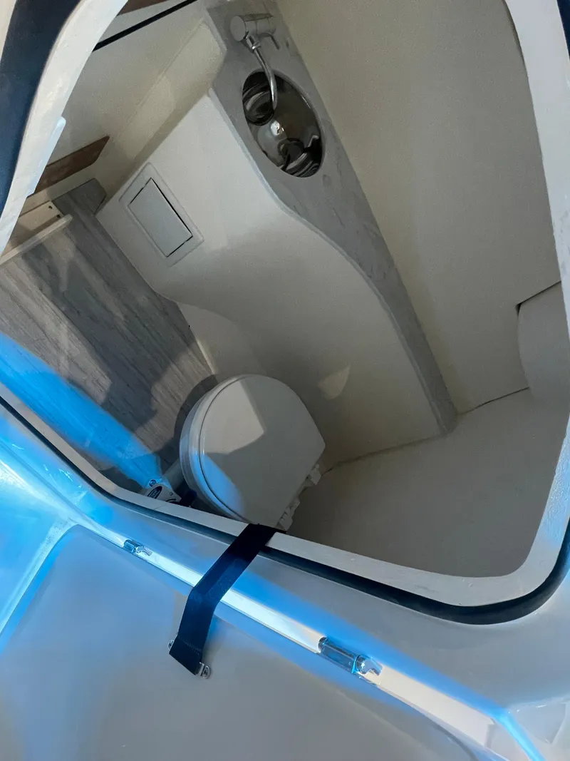 Slide: The Image of 2024 Scout 240 Dorado boat interior with sink and toilet. - 9