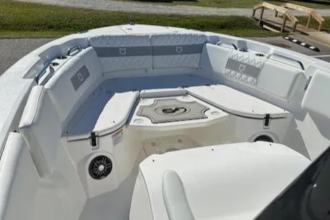 Slide: The Image of 2024 Sea Fox 268 Commander boat interior with cushioned seating and speakers. - 11