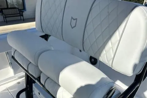 Slide: The Image of 2024 Sea Fox 268 Commander boat seat with diamond stitching and armrests. - 12