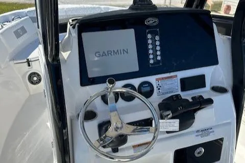 Slide: The Image of 2024 Sea Fox 268 Commander dashboard with Garmin navigation system and steering wheel. - 13