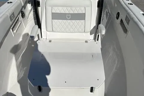 Slide: The Image of 2024 Sea Fox 268 Commander boat interior with cushioned seating and armrests. - 7