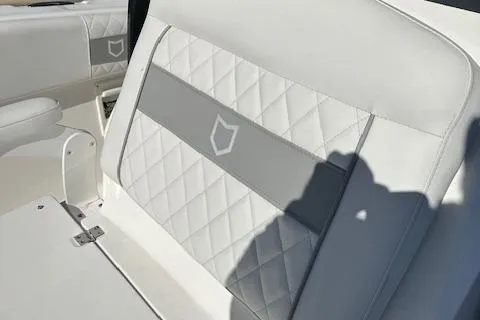 Slide: The Image of 2024 Sea Fox 268 Commander boat seat with white and gray quilted upholstery. - 8