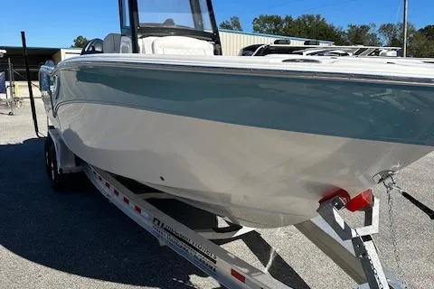 Slide: The Image of 2024 Sea Fox 268 Commander boat on trailer, side view in outdoor setting. - 9