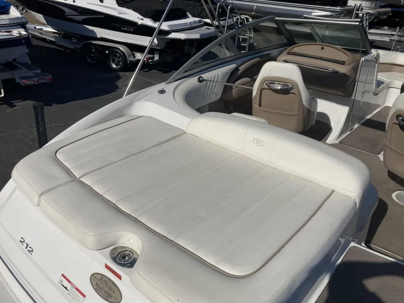 Slide: The Image of 2007 Cobalt 212 boat interior with white seating and dashboard. - 12