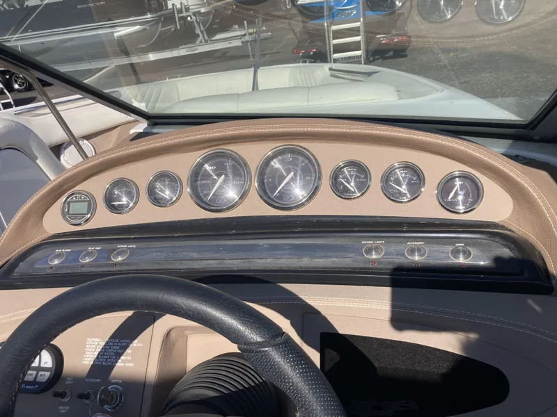 Slide: The Image of Dashboard of a 2007 Cobalt 212 boat with gauges and controls. - 14
