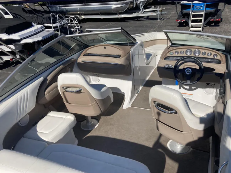 Slide: The Image of Interior of a 2007 Cobalt 212 boat with beige and white seating. - 6