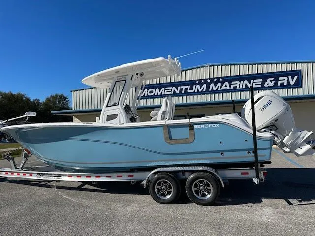 The Image of 2024 Sea Fox 268 Commander boat on trailer at Momentum Marine & RV dealership. - 1