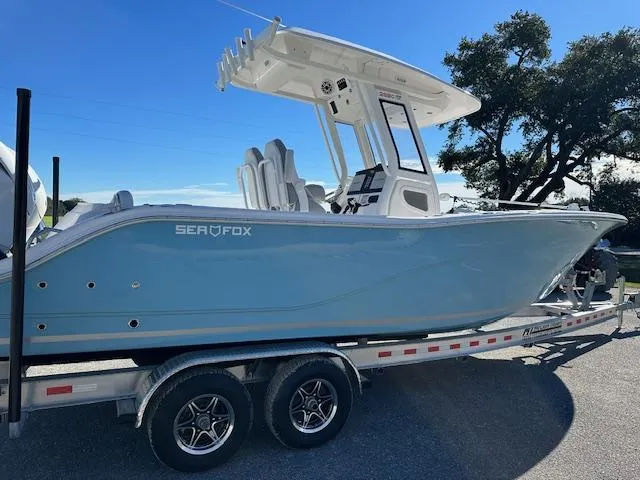 Slide: The Image of 2024 Sea Fox 268 Commander boat on trailer, side view, sunny day. - 17