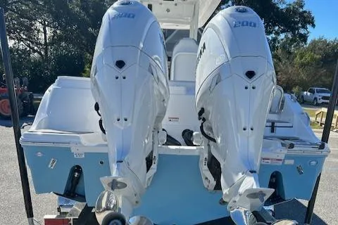 Slide: The Image of 2024 Sea Fox 268 Commander with dual outboard engines, rear view. - 2
