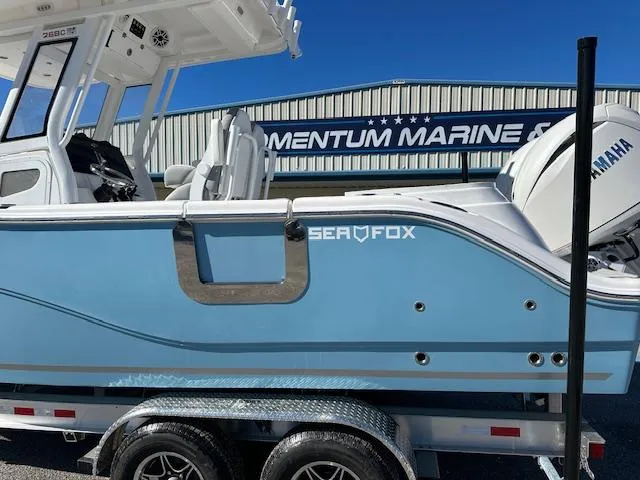 Slide: The Image of 2024 Sea Fox 268 Commander boat in light blue on a trailer at Momentum Marine. - 3