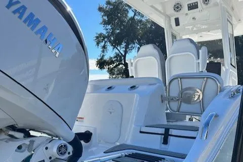 Slide: The Image of 2024 Sea Fox 268 Commander boat with Yamaha engine, featuring sleek white seating and modern design. - 4