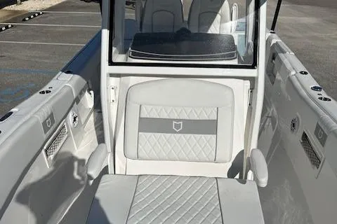 Slide: The Image of 2024 Sea Fox 268 Commander boat interior with white seating and modern design. - 6