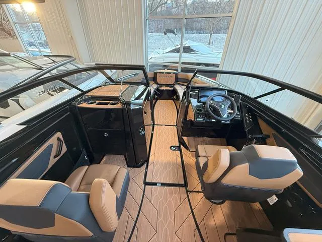 Slide: The Image of 2025 Yamaha Boats 255XD interior with modern design and comfortable seating. - 13