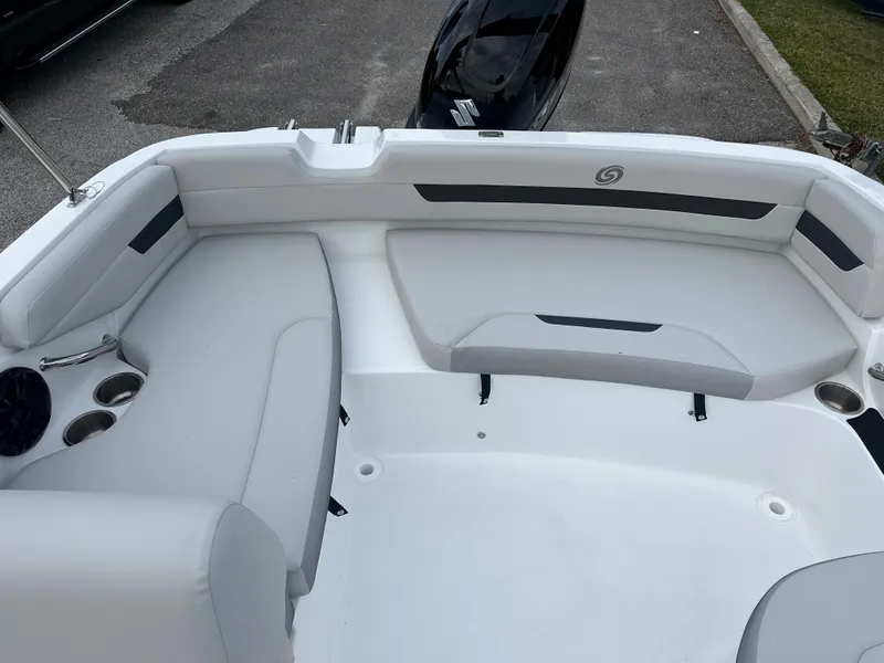 Slide: The Image of 2024 Hurricane SunDeck Sport 185 OB boat interior with white seating and cup holders. - 8