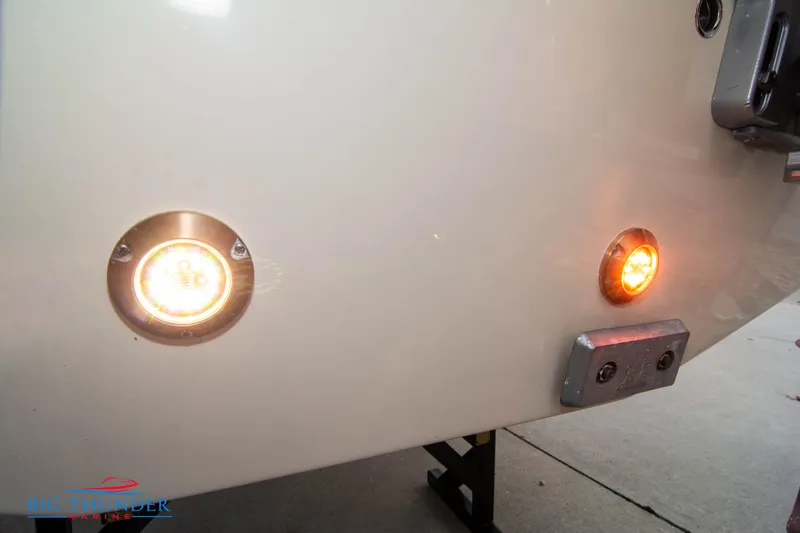 Slide: The Image of 2024 Chris-Craft CALYPSO 35 CP stern lights and hull detail. - 10