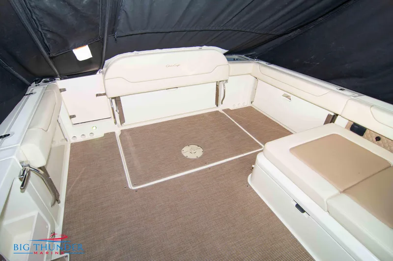 Slide: The Image of 2024 Chris-Craft CALYPSO 35 CP boat interior with beige seating and carpeted floor. - 19