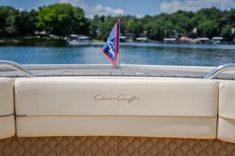 Slide: The Image of 2024 Chris-Craft Calypso 35 boat with elegant seating and lake view. - 49