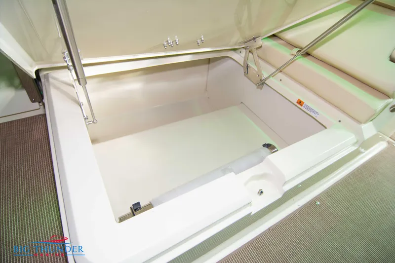 Slide: The Image of 2024 Chris-Craft CALYPSO 35 CP storage compartment with open lid. - 31