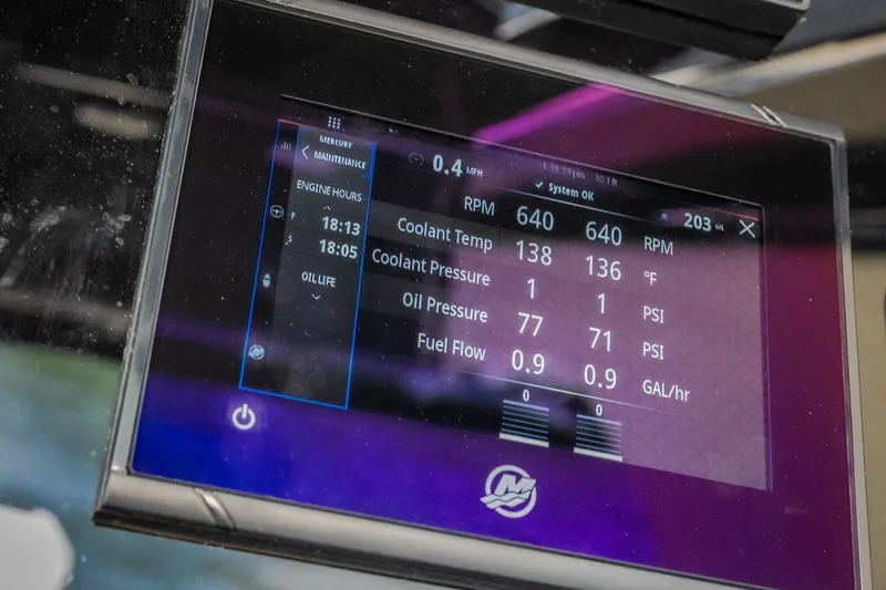 Slide: The Image of Display screen of 2024 Chris-Craft Calypso 35 showing engine metrics and maintenance data. - 37