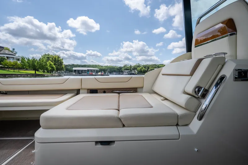 Slide: The Image of Luxurious seating on 2024 Chris-Craft Calypso 35 boat, with scenic lake view. - 21