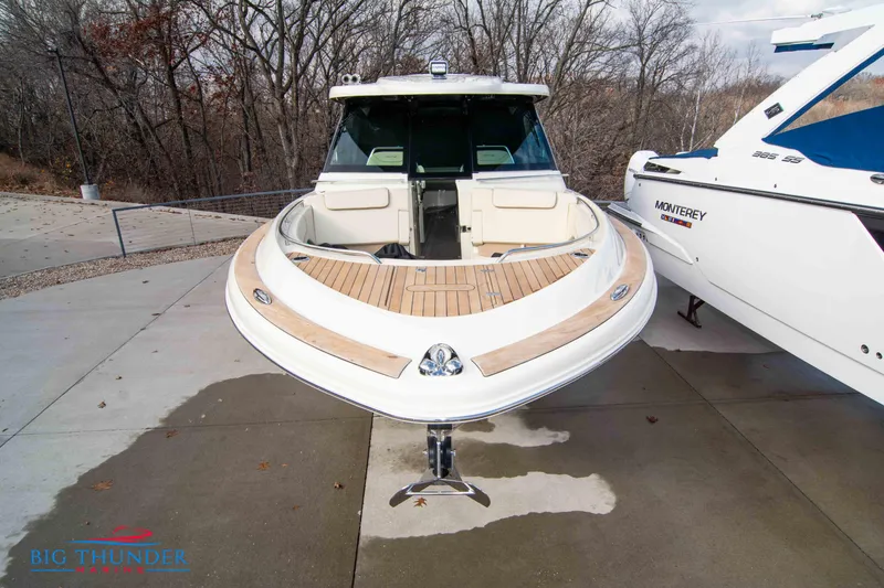 Slide: The Image of 2024 Chris-Craft CALYPSO 35 CP boat docked, front view with teak deck. - 4