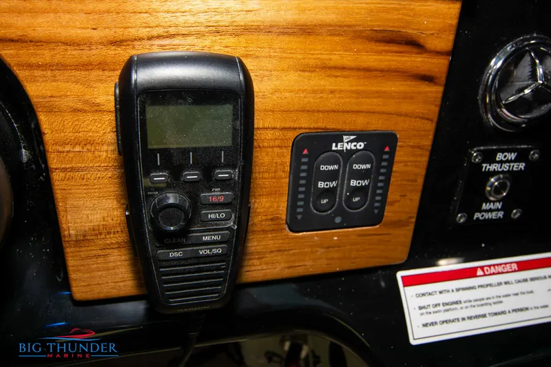 Slide: The Image of Control panel of 2024 Chris-Craft CALYPSO 35 CP boat with radio and Lenco trim tabs. - 44