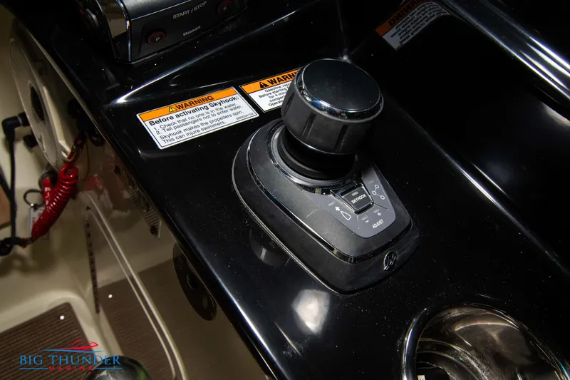 Slide: The Image of Chris-Craft CALYPSO 35 CP 2024 joystick control on black console. - 48
