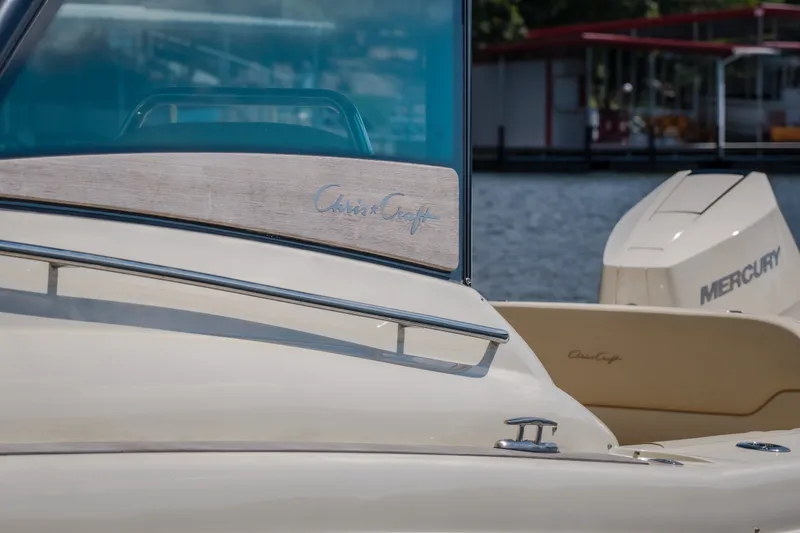 Slide: The Image of 2024 Chris-Craft Calypso 35 boat with Mercury engine, docked by the water. - 68