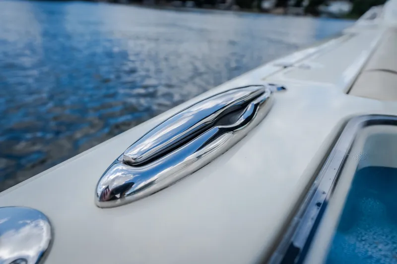 Slide: The Image of Close-up of 2024 Chris-Craft Calypso 35 boat cleat on water. - 63