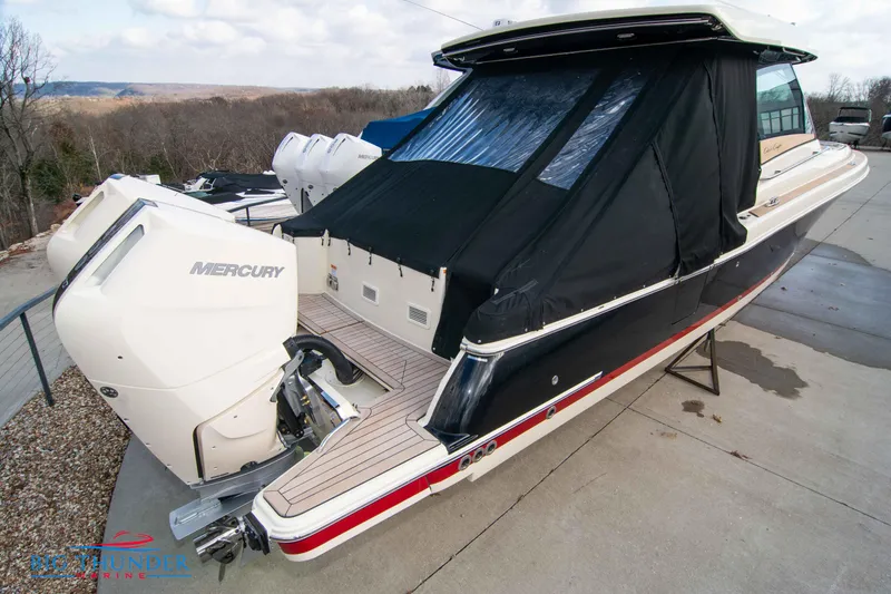 Slide: The Image of 2024 Chris-Craft CALYPSO 35 CP boat with Mercury engines, rear view. - 6