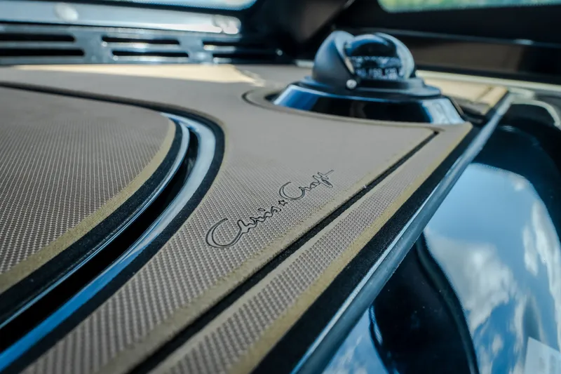 Slide: The Image of 2024 Chris-Craft Calypso 35 dashboard with elegant detailing and logo. - 32