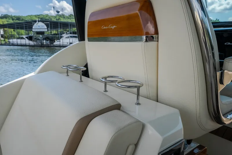 Slide: The Image of Luxurious interior of 2024 Chris-Craft Calypso 35 boat with cup holders and elegant seating. - 65