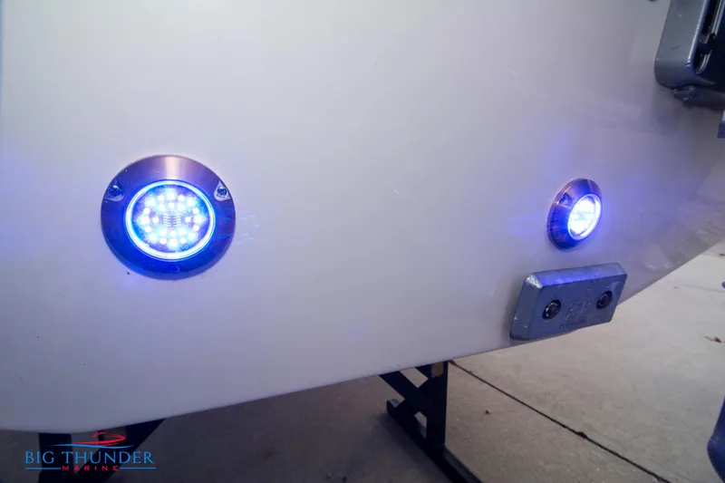 Slide: The Image of 2024 Chris-Craft CALYPSO 35 CP boat with blue underwater lights. - 8